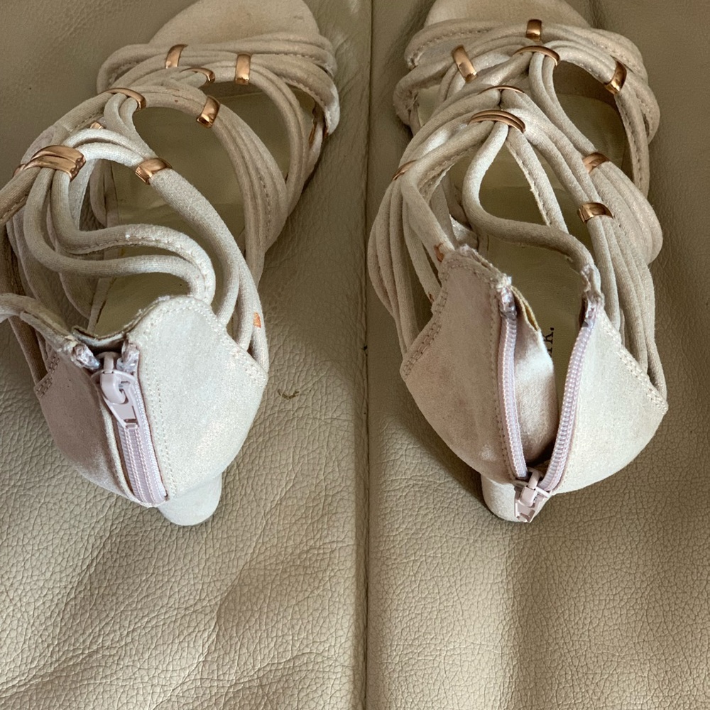 Shoes upper is a shinny rope sandal, a Gold heel as shown with zipper back.